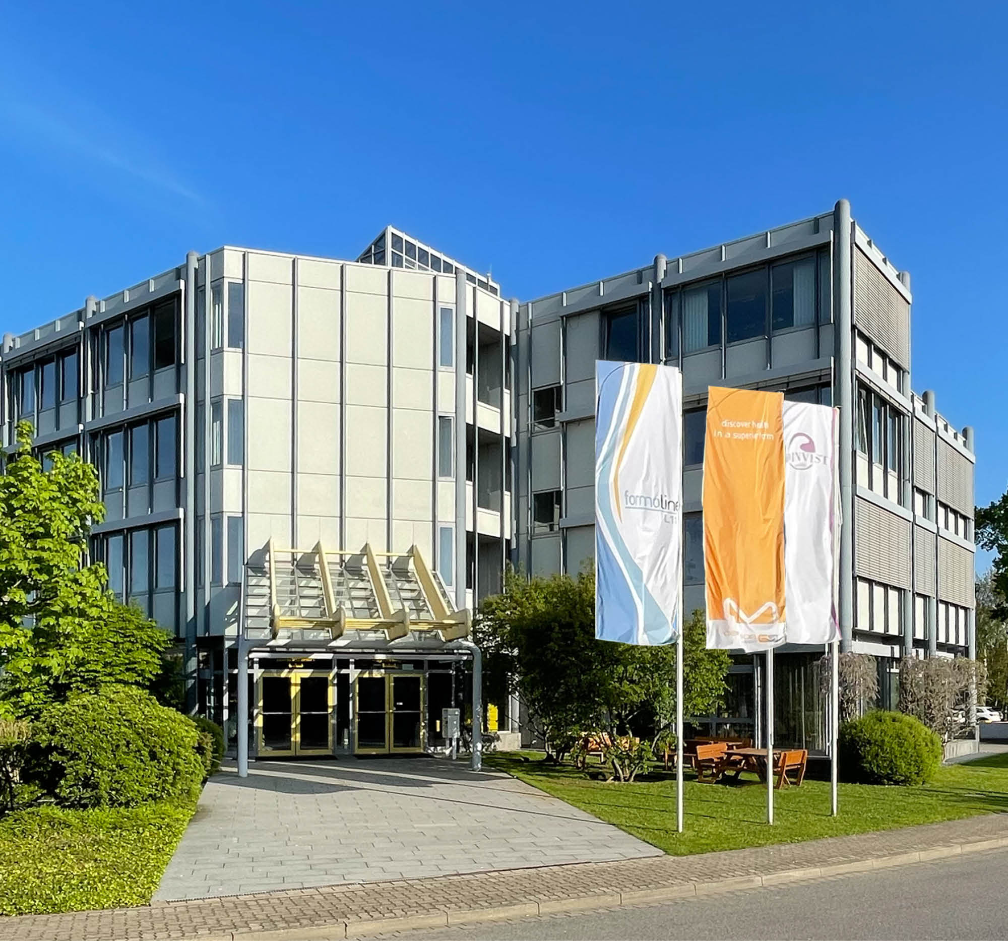 Certmedica company building with formoline flags outside the entrance