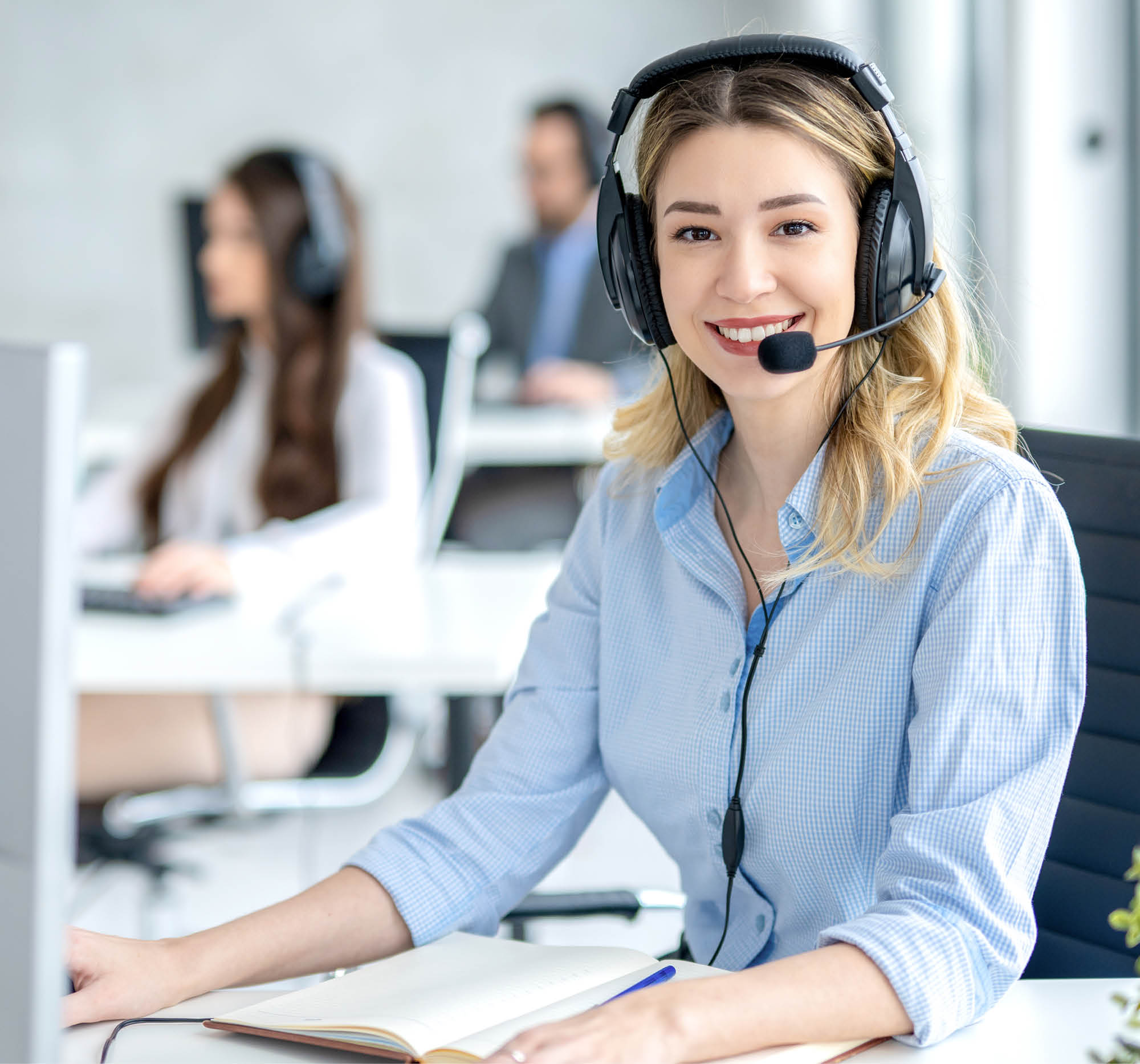 customer service agent with headset assisting clients in office environment